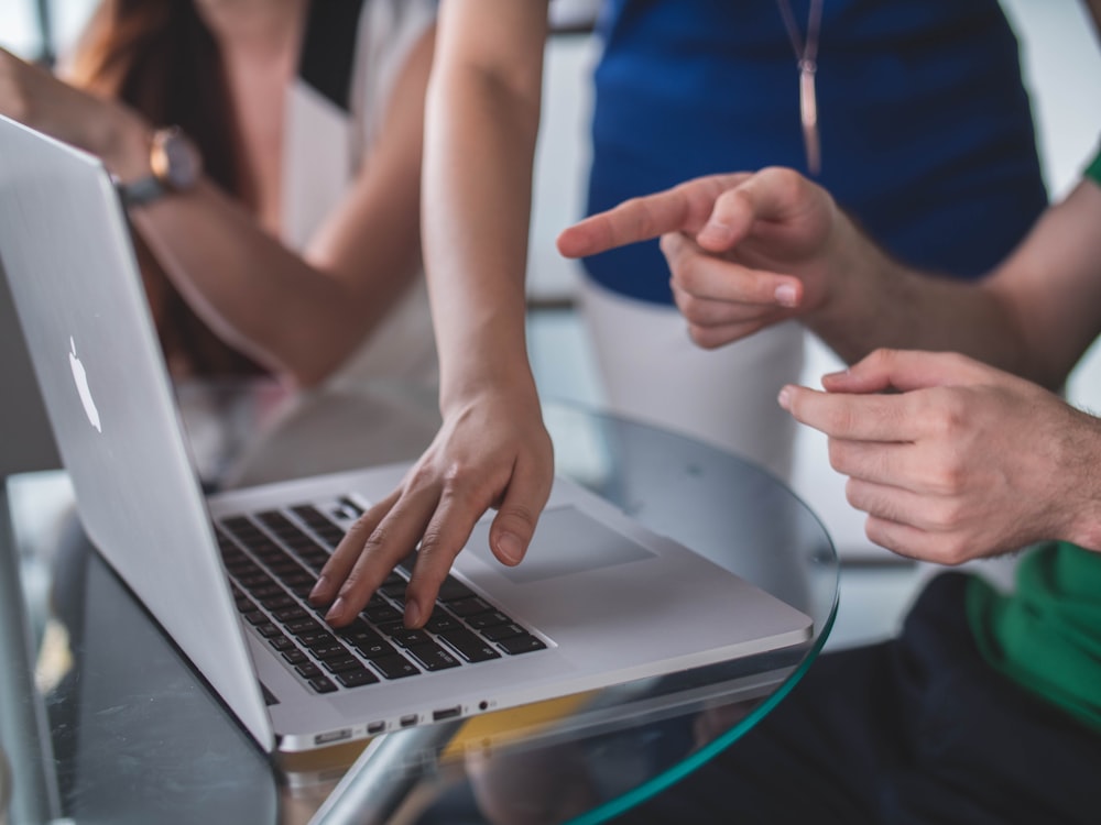 A mentor guiding an intern through code