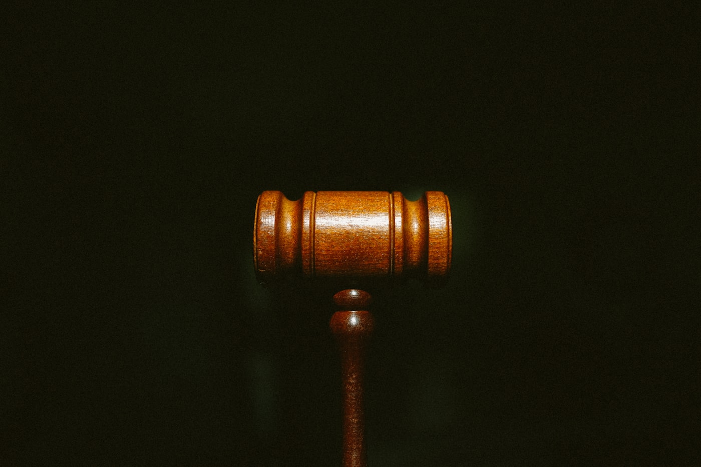 Wooden gavel on a dark background